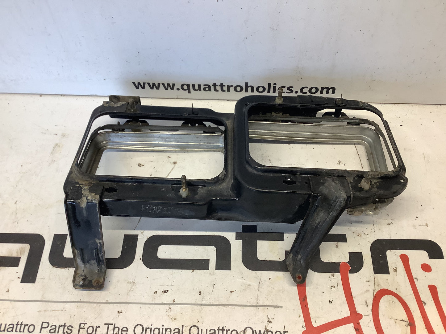 Early Quad Headlight Bracket Pair